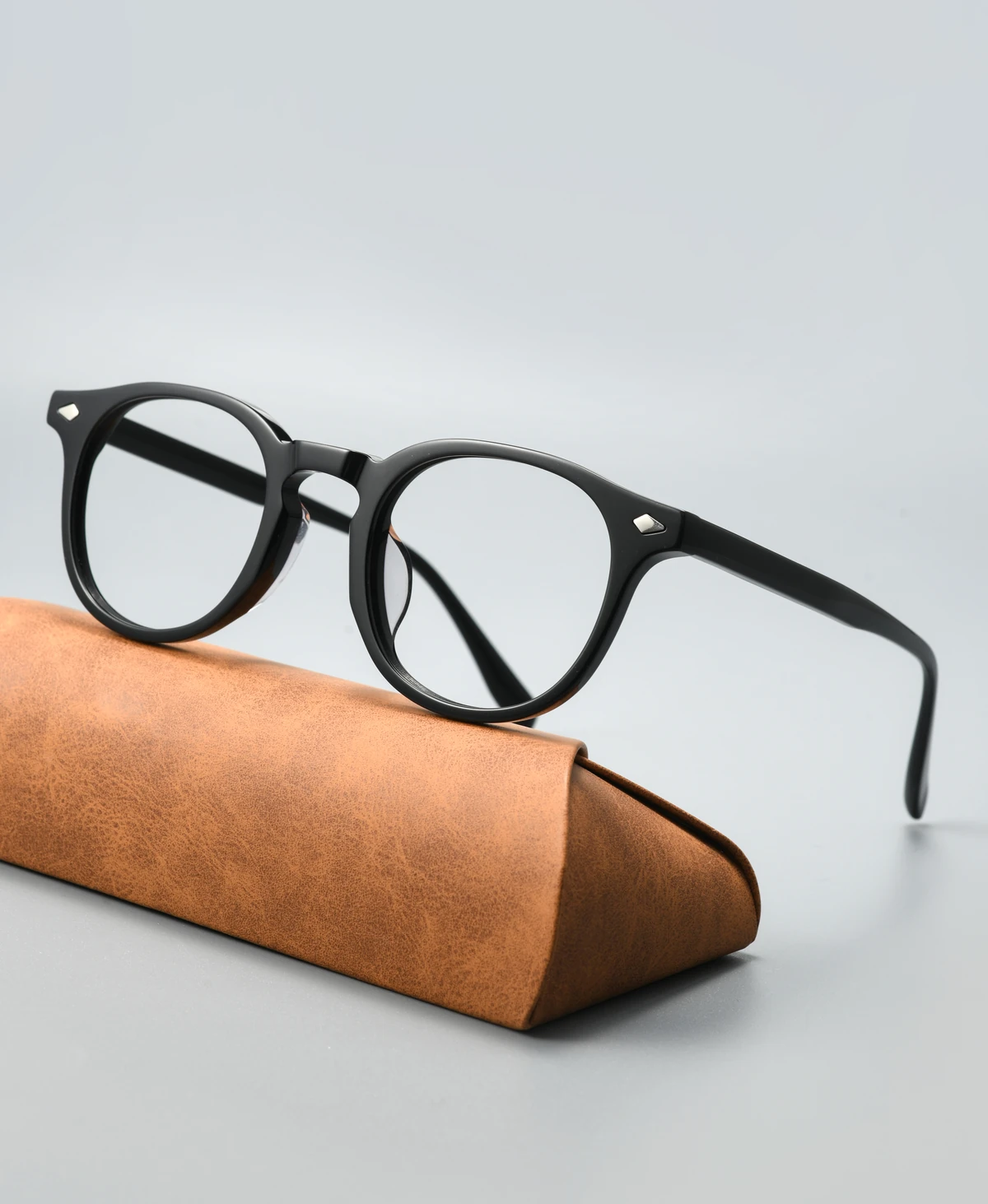 Acetate eyeglass frame GG6010F viewed at an angle on a display case