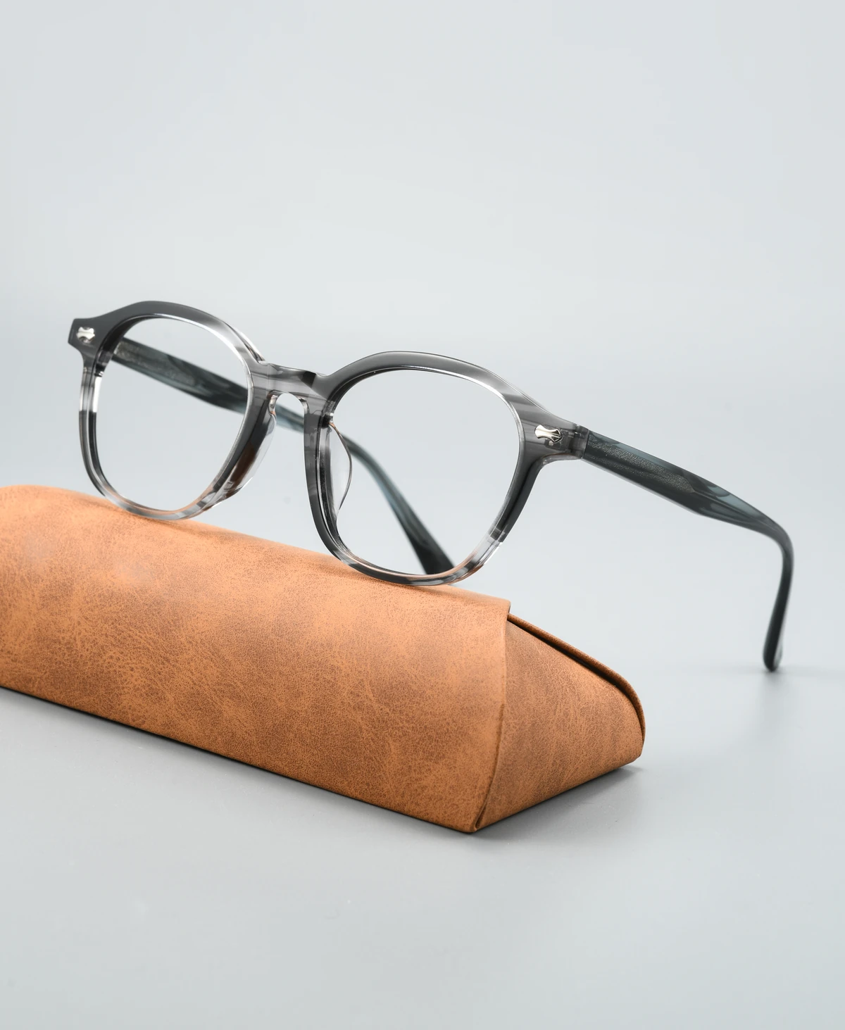 Acetate eyeglass frame GG6012F viewed at an angle on a display case