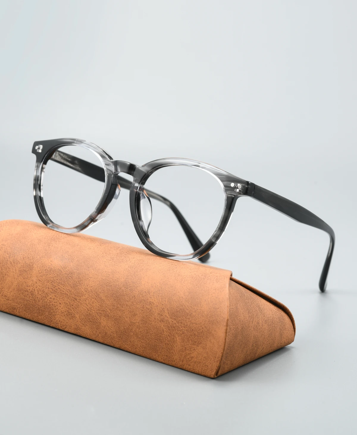 Catalog angle view of acetate eyeglass frame GG6014F with a display case