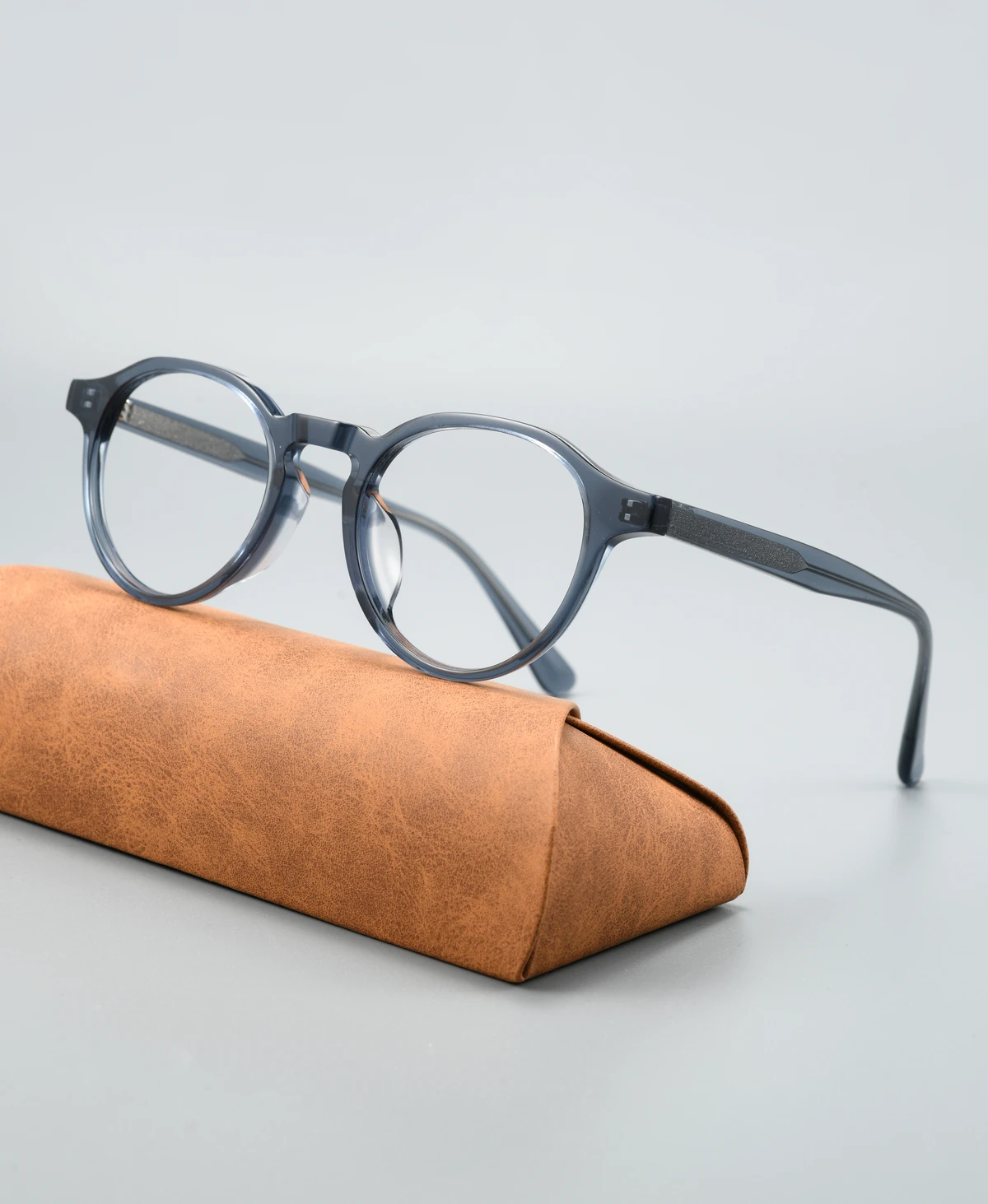 Catalog angle view of acetate eyeglass frame GG6015F with a display case