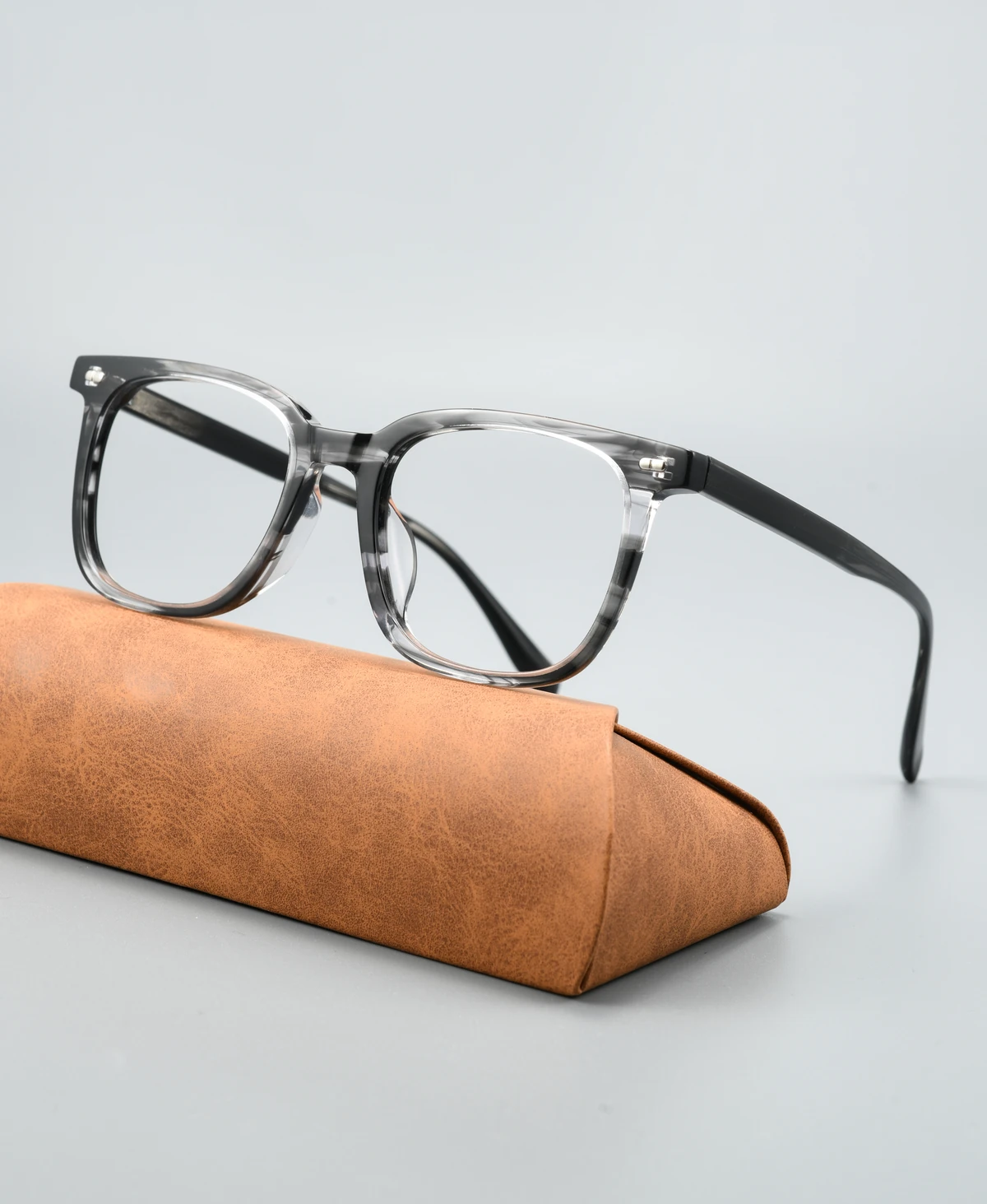 Acetate eyeglass frame GG6017F viewed at an angle on a display case