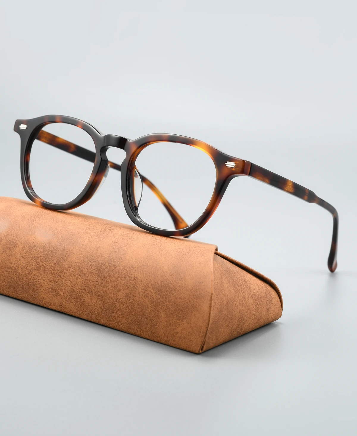 Acetate eyeglass frame GG6018F viewed at an angle on a display case