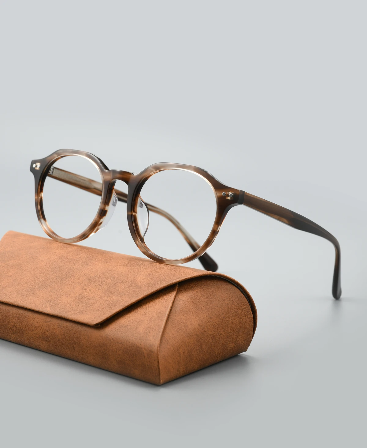 Catalog angle view of acetate eyeglass frame GGF6001BJZ with a display case
