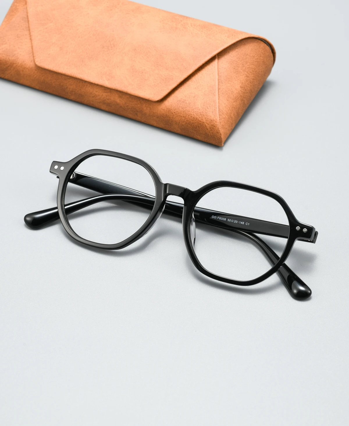 Catalog angle view of acetate eyeglass frame GGF6008BJZ with a display case